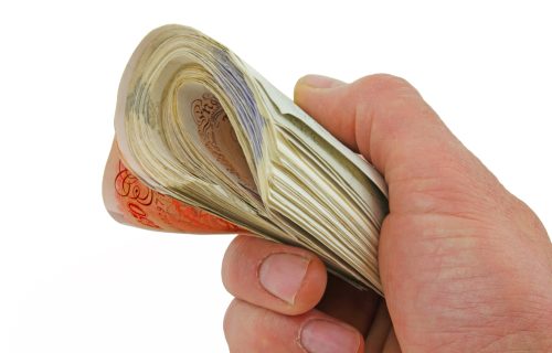 Blog_Reason_Carpet_man-holding-a-wad-of-50-pound-notes-cash